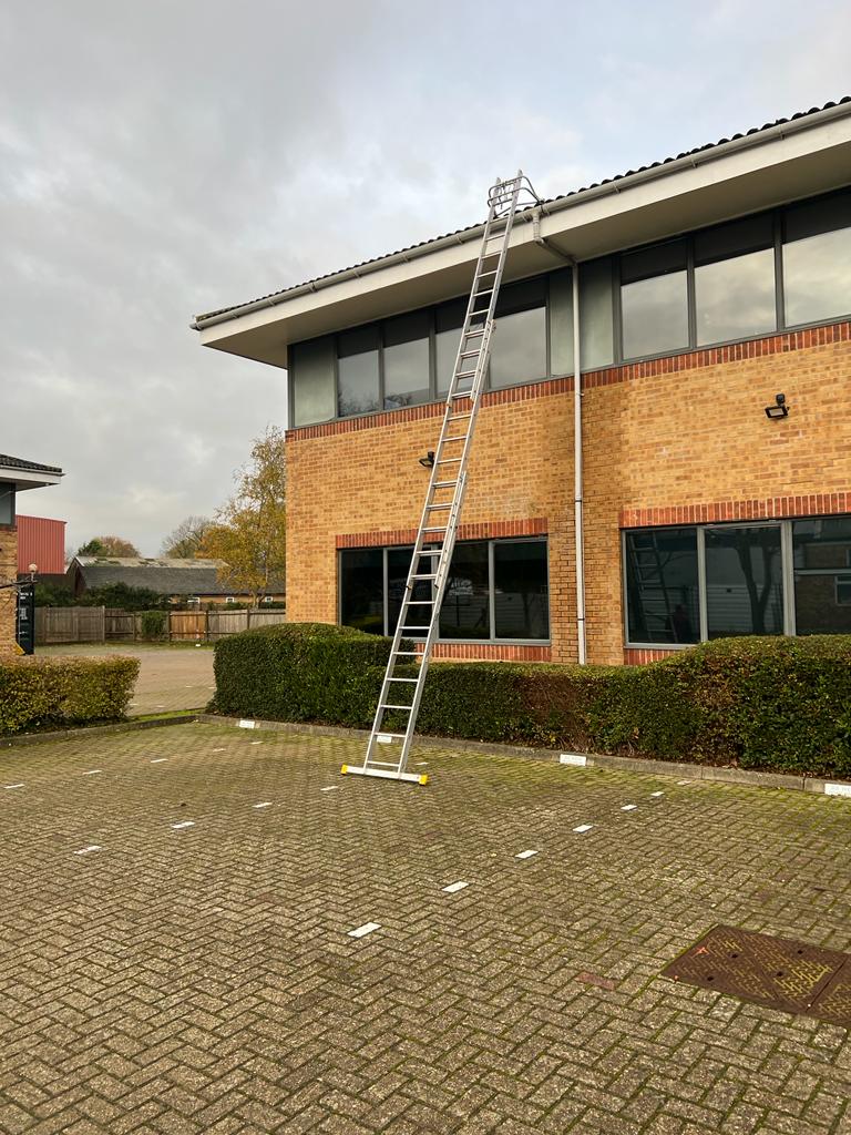 rain gutter cleaning on industrial property